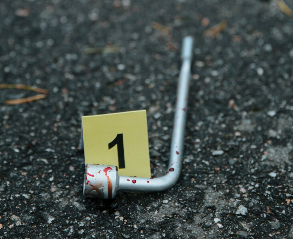 Tire wrench with blood used to create a wound pattern